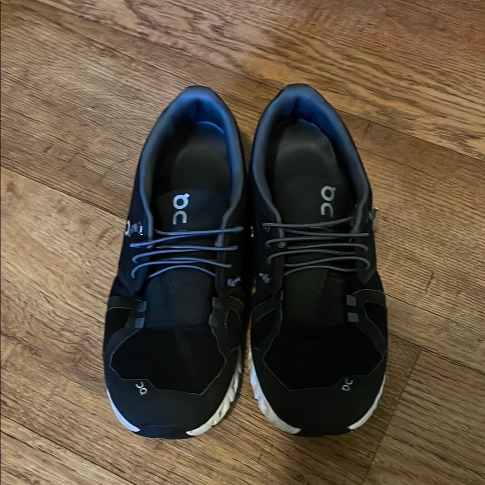On Running Black and White Athletic Shoes with Modern Design